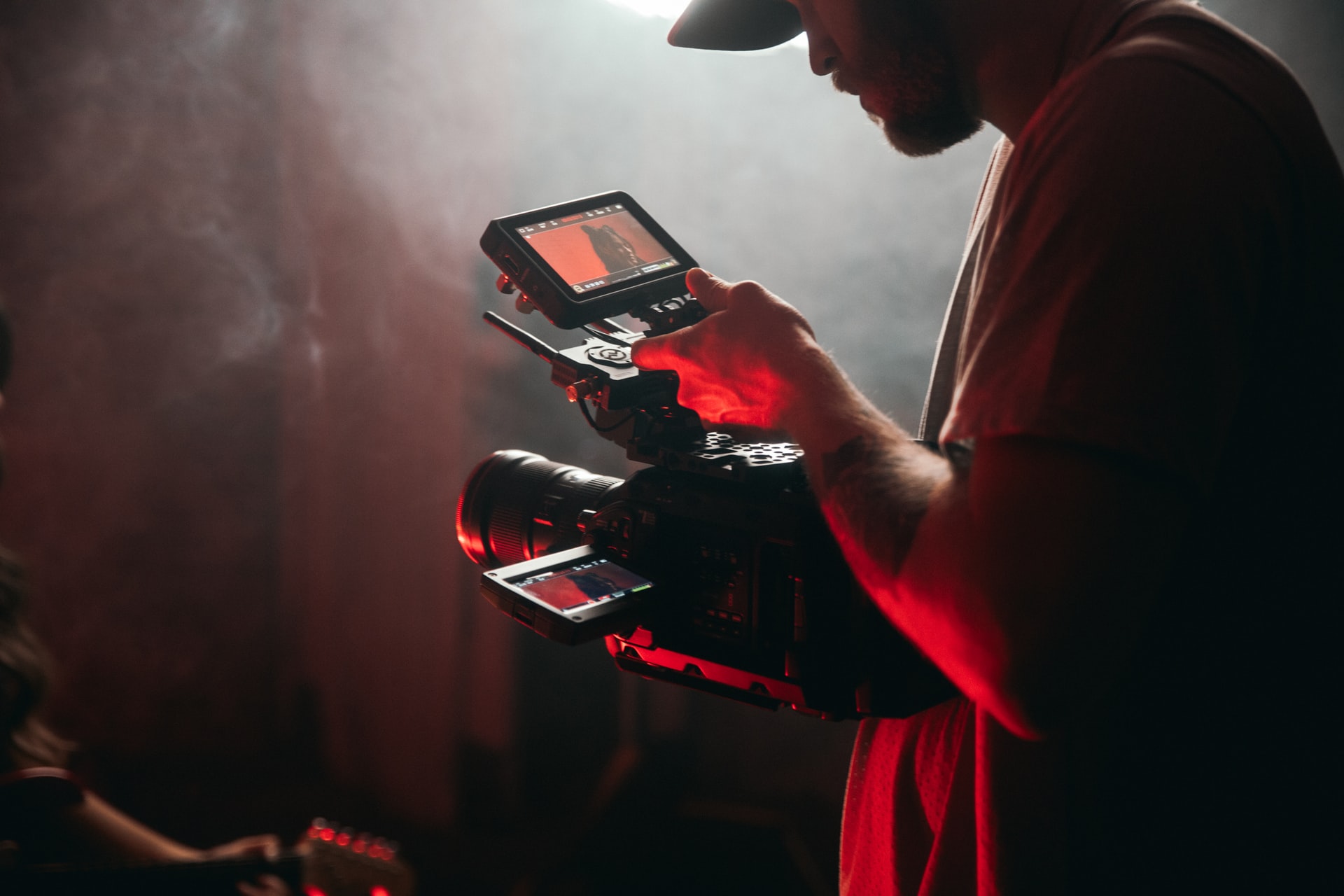 A man recording with a camera.